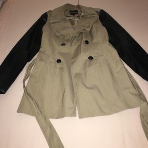 Tan trench coat with black leather sleeves